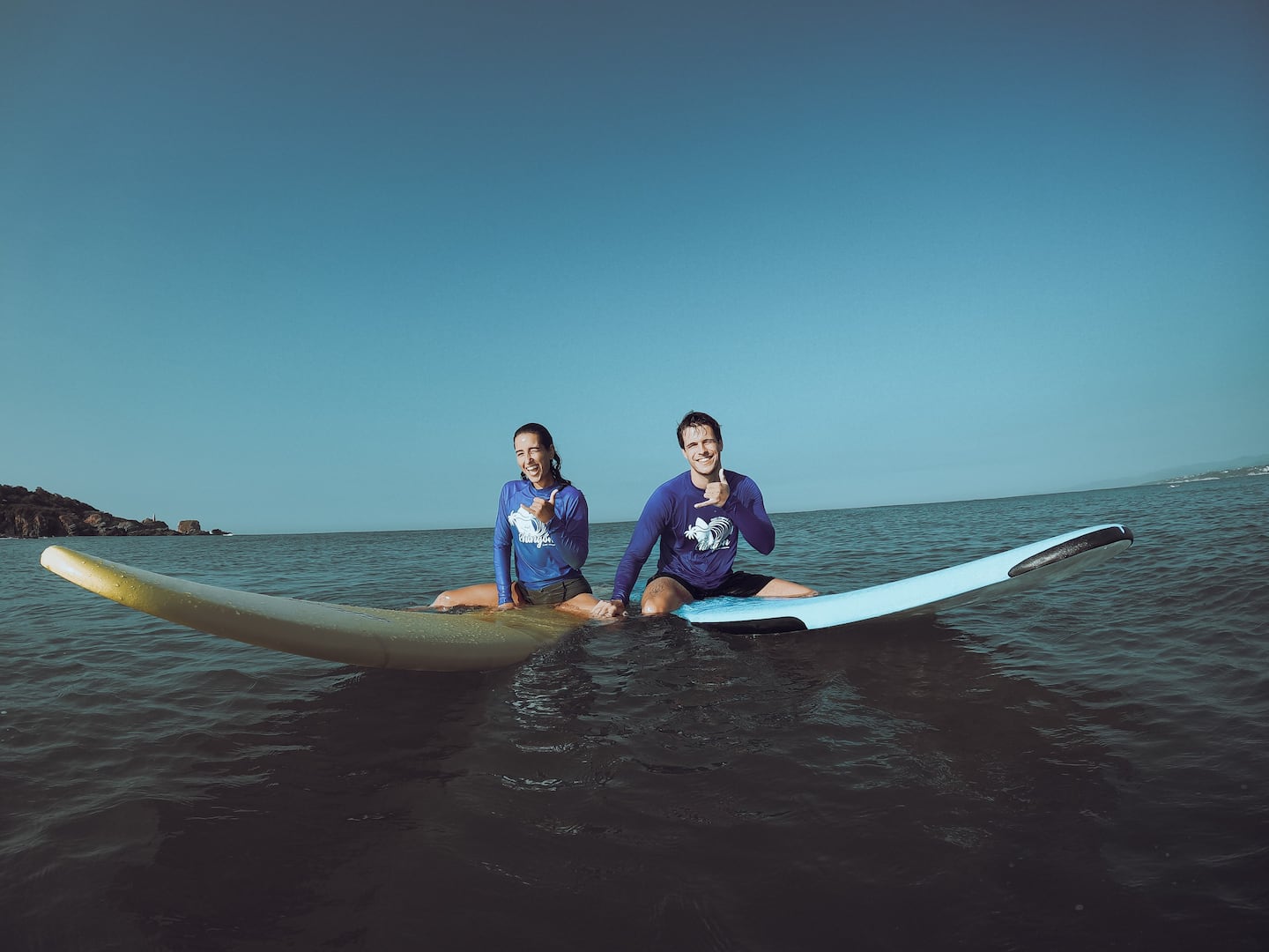 woman taking surfing lessons Puerto Escondido