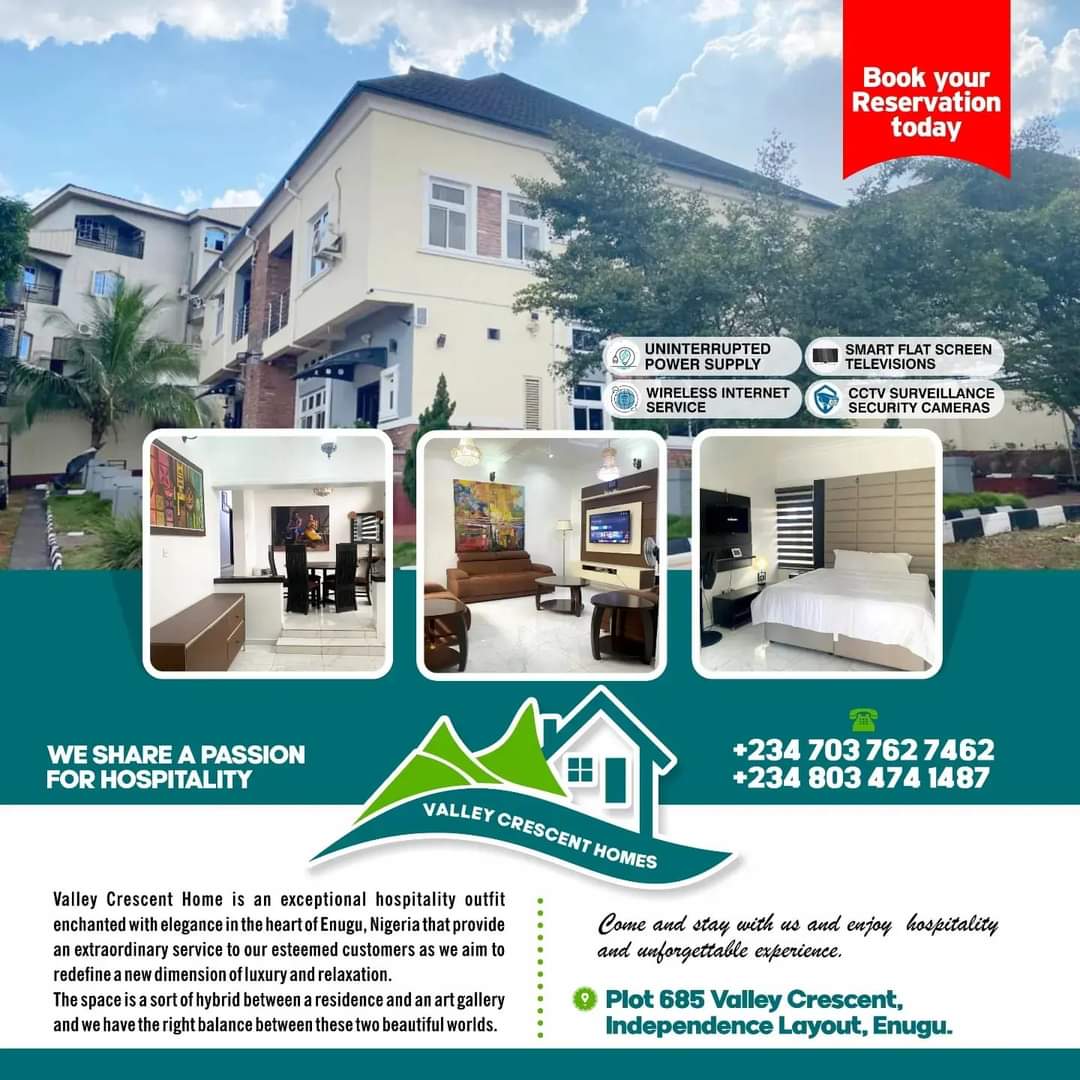 The image displays a modern building, showcasing a blend of contemporary architecture and welcoming design. A spacious living area is visible, highlighted by a large piece of wall art. Outdoor spaces are framed by greenery, suggesting a harmonious connection to nature.