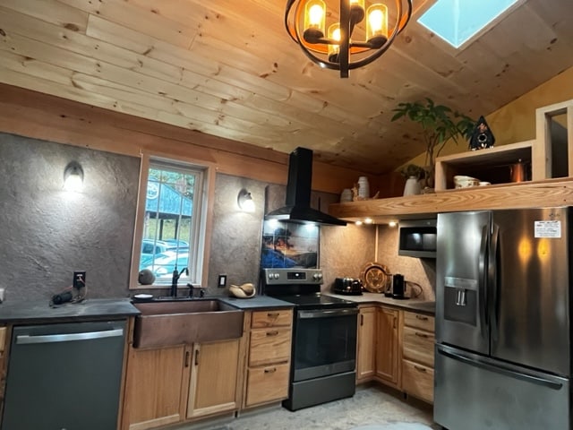 A well-appointed kitchen features wooden cabinetry and a stainless steel refrigerator. A large sink and modern appliances, including a stove and microwave, are present. Natural light fills the space through a window above the sink, and stylish light fixtures add warmth to the room.