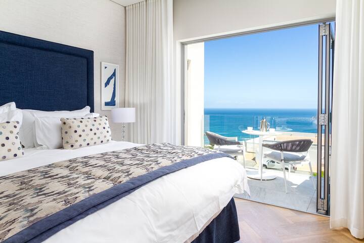 Luxurious main bedroom (king bed);  private balcony with ocean view