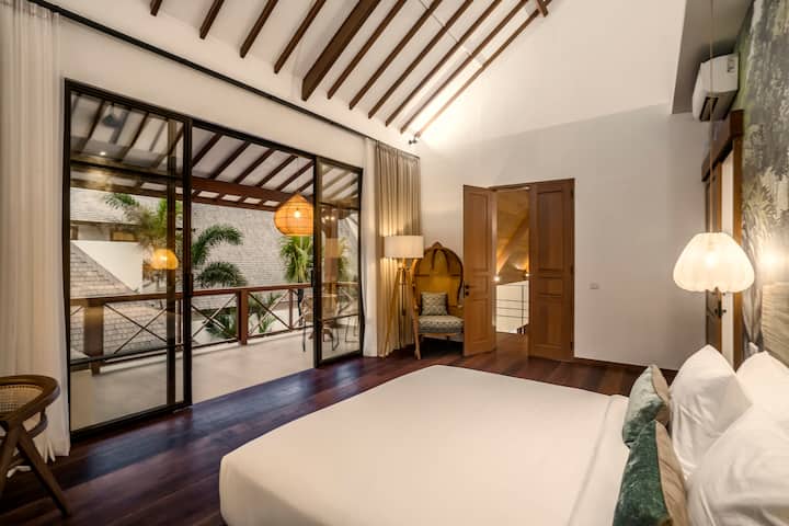 Wake up to the soothing symphony of nature in this bedroom oasis, where the pool view becomes your morning masterpiece