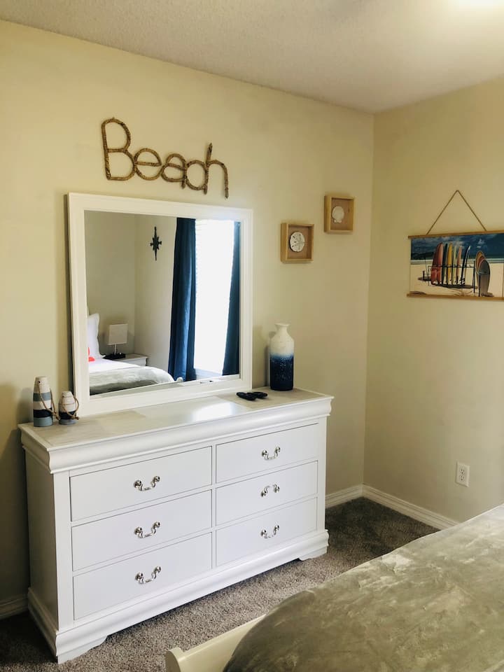 Queen bedroom with medium firm mattress with a 3" topper, so can be removed if want a firmer bed. adjustable head and foot. Roku Smart TV. Lamps with USB and multi charger
