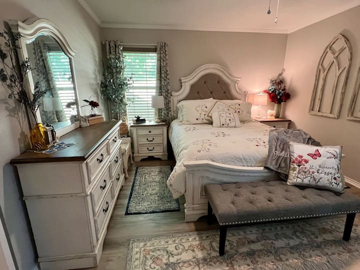 Bedroom 1, Queen bed, walk in closet, black out curtains, dressers and tv.