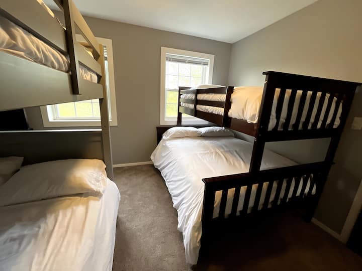 Bunk room with full over full and twin over full bunkbeds