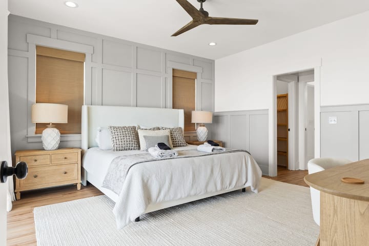 Bedroom 1 - Primary: King bed with private en-suite bathroom & smart TV 