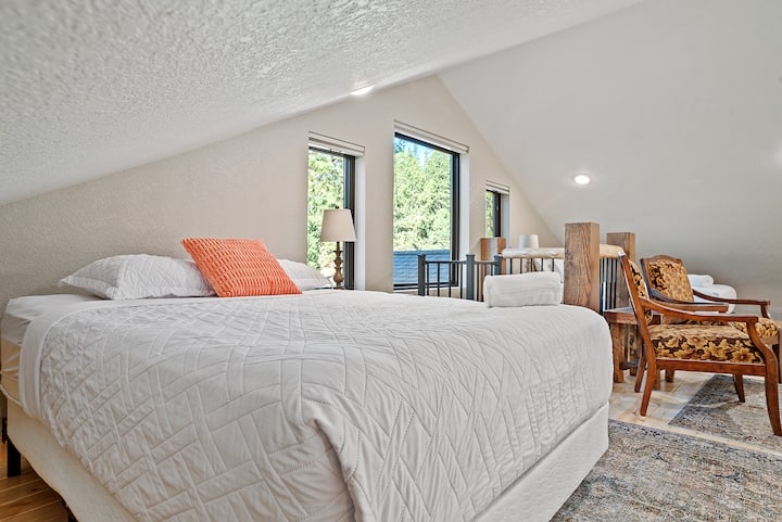 Loft Bedroom: Elevated loft beds and cozy chairs, offering a unique and space-saving bedroom setup.