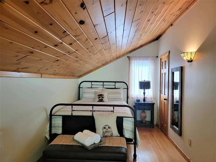 Loft Bedroom #1 has a queen sized bed and ottoman with pull-out single sized memory foam mattress. Both loft bedrooms have sound machines to help you sleep a little better at night.