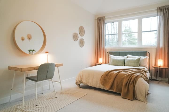 This beautiful master bedroom on the 2nd floor has a queen sized bed and ceilings that are high enough to accommodate your high spirits when you wake up