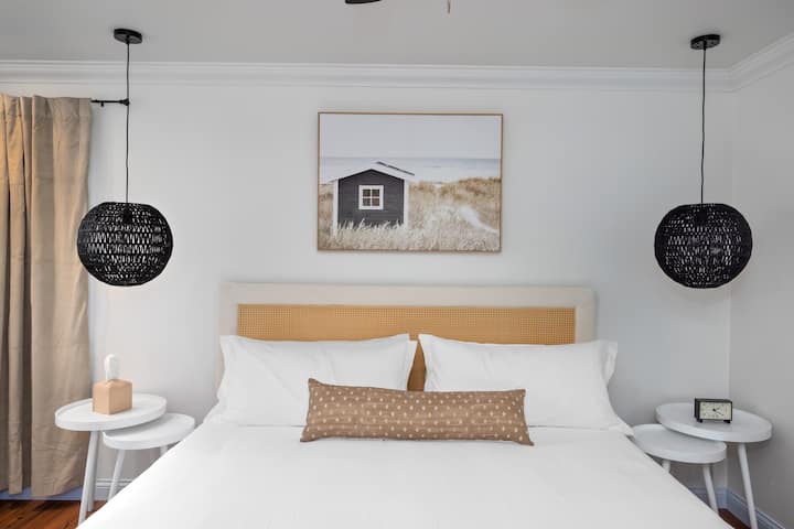 Dive into coastal bliss in our chic bedroom, where tranquil waves meet stylish comfort

(Bedroom one 13' 9" x 12' 0" first floor) 