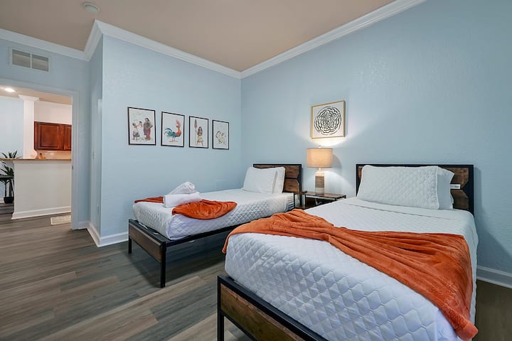 Wake Up to Sunshine! This airy twin bedroom with a Smart TV offers the perfect blend of comfort and entertainment, with plenty of space to relax.