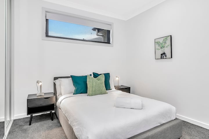 The second bedroom includes a double bed, with mirrored built-in robes creating a feeling of spaciousness.  
