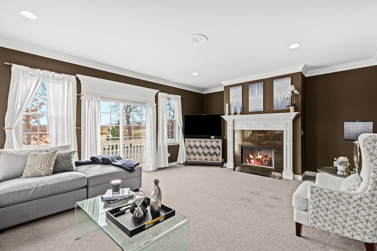 Living room with fireplace in the Howell property