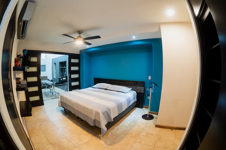 Master room, king size bed, and a studio next door with a sofa bed.