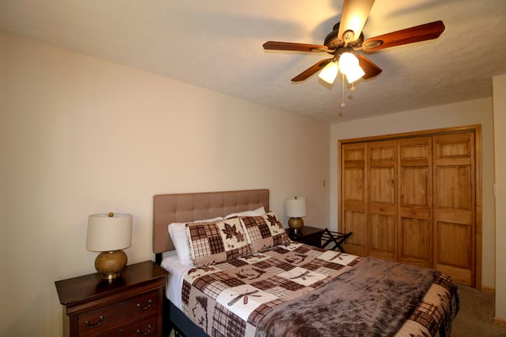 Third floor bedroom with queen bed. 