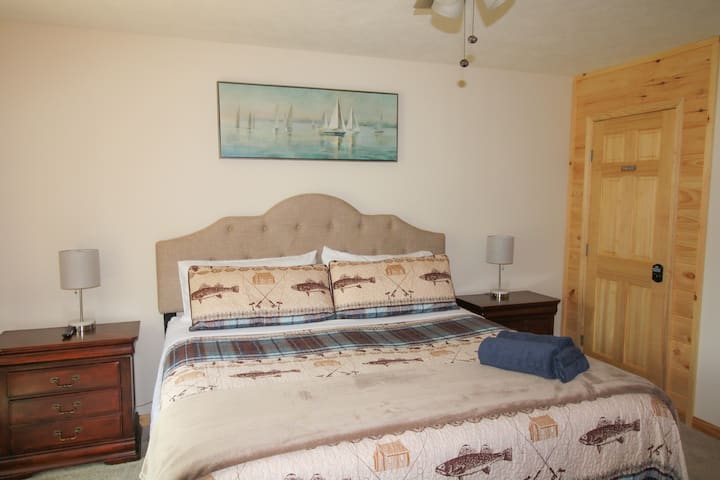 Main bedroom just off the kitchen with a door directly to a full bathroom & laundry room. 
