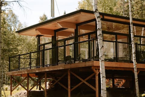 Modern cabin with spa and fireplace in nature