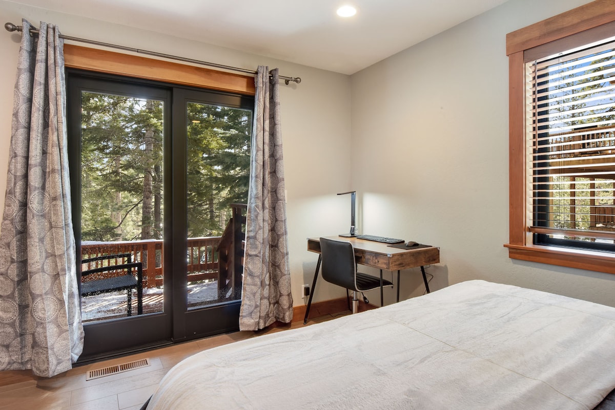 Dedicated workspace + balcony access in Bedroom 1