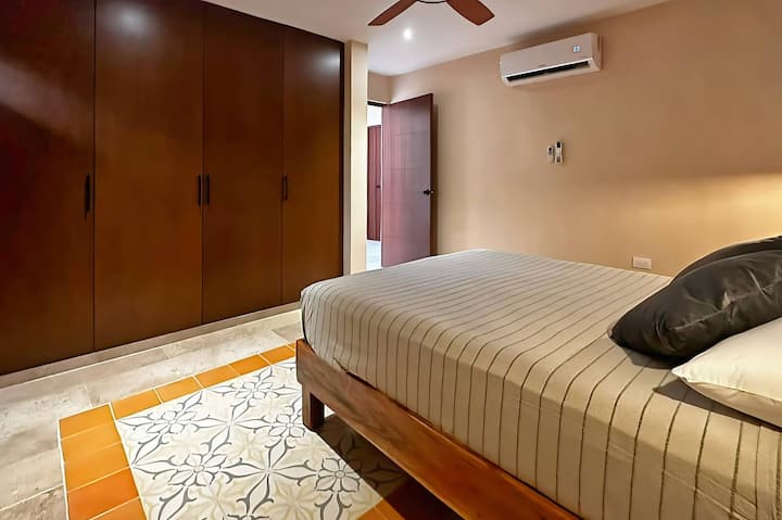 Each of the three bedrooms on the first floor is equipped with cozy beds, air conditioning, and its own bathroom. If you don't want to use the A/C, one ceiling fan in each bedroom will provide you with a breeze.