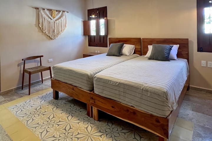 One of the bedrooms can be used flexibly as a double bed or with single beds, as needed.