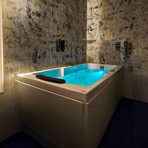 Luxe Jacuzzi, King SizeBed & Private Balcony."