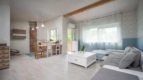 Studio with balcony and garden view