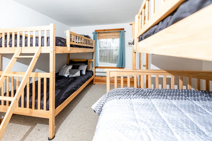 Discover Kids Room #2, offering the perfect setup with both a twin bunk bed and a full/twin bunk bed for versatile sleeping arrangements!