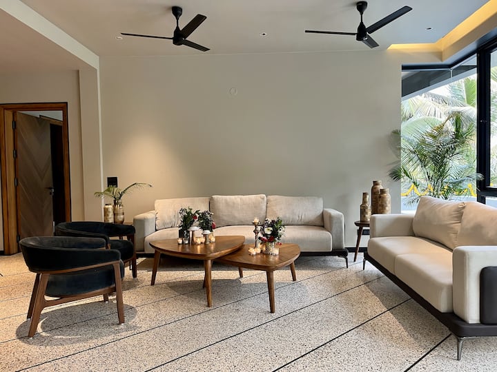 Sink into our plush chairs and let your worries melt away in our luxurious living room.