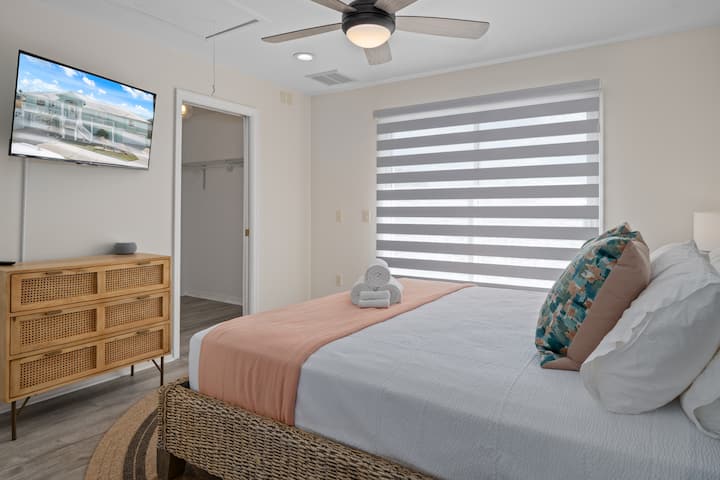 Another king size bed with direct access to the massive outside deck and porch along with large walk-in closet