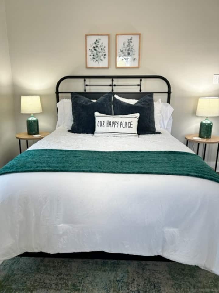Queen bed with luxury Malouf sheets.