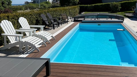 Home with heated pool by the sea and beach