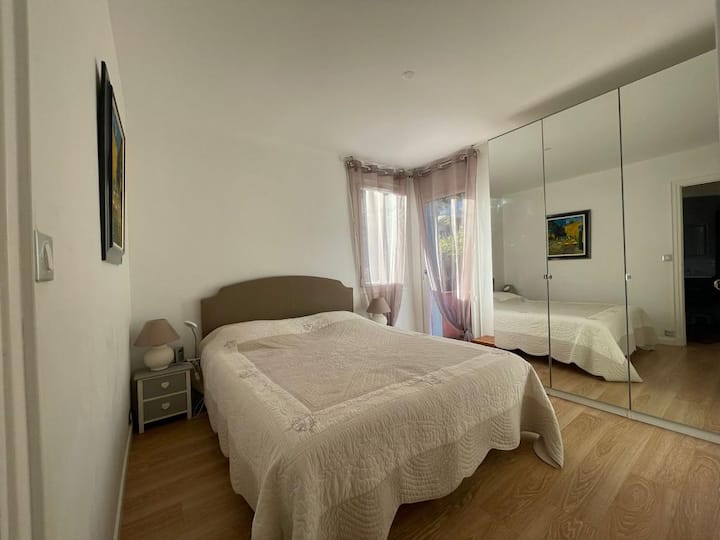 Bedroom 1 with a 160x200 bed a large storage closet with a small northwest facing balcony