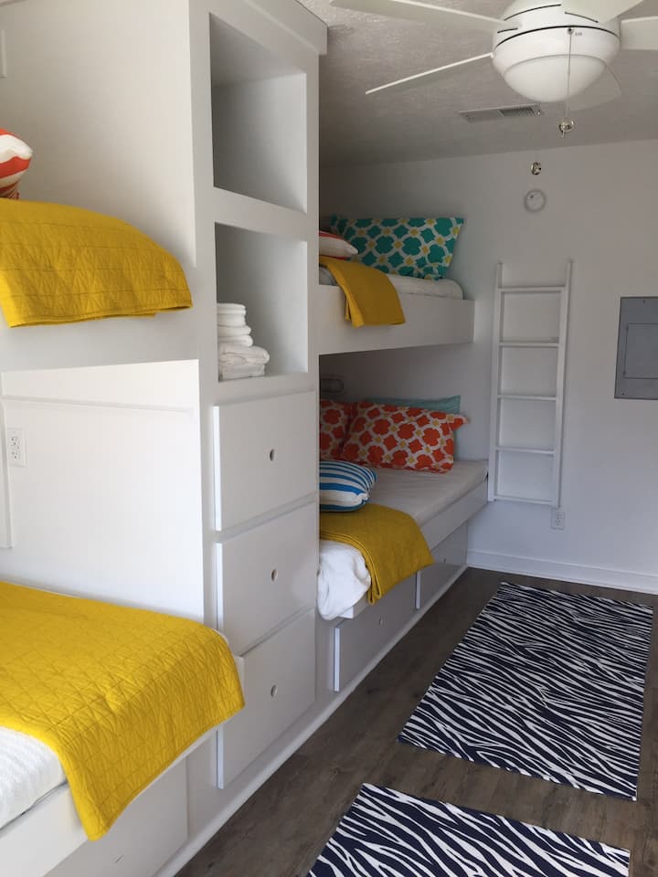 Downstairs bunk room with 2 queen and 2 full bunks