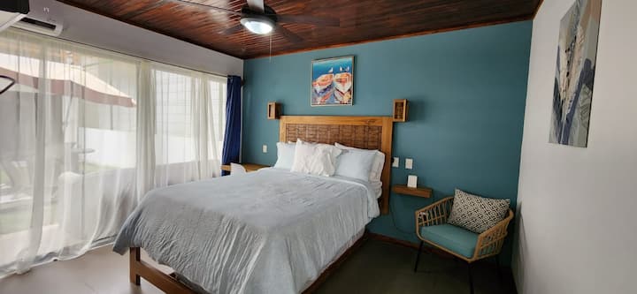 Bedroom with a queen-size bed and trundle. 
