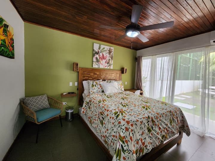 Bedroom with a queen-size bed and trundle. 