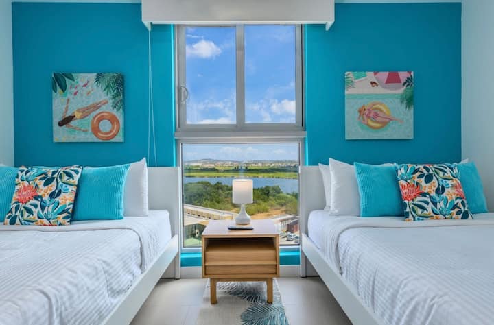 Bedroom 3 has a view of the lake, the inner island and the bird sanctuary.  It features 2 double beds and an en-suite bathroom