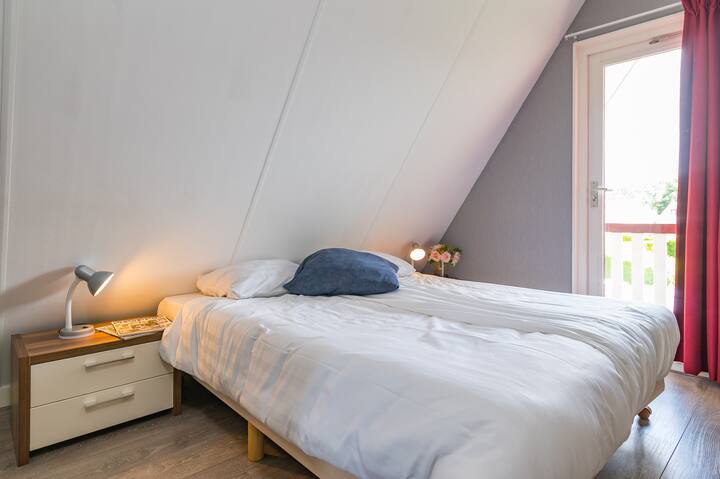Bedroom 2 on the 2nd floor with balcony. There is 2 box spring beds and enough space for placing a cot if desired.
The beds can be placed separately or next to each other.