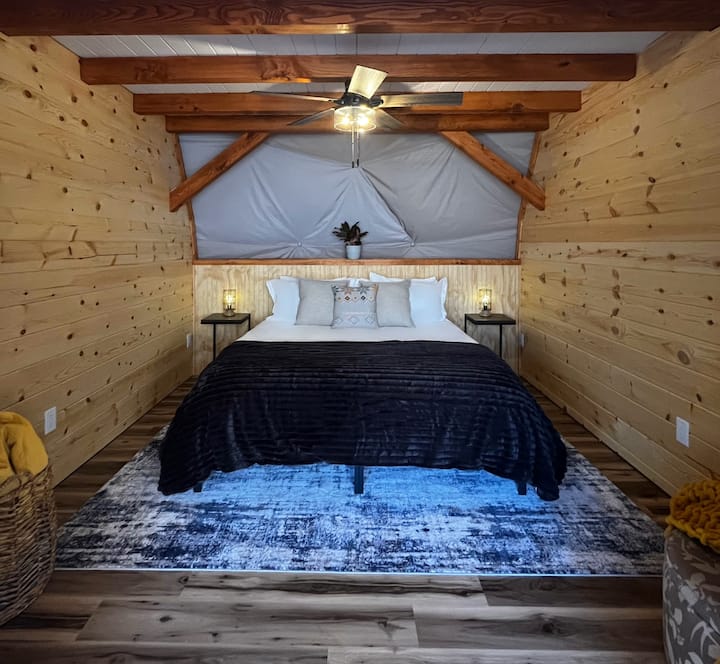 Huge private bedroom with California King memory foam mattress infused with green tea. Barn doors slide closed on the bedroom for privacy and darkness.