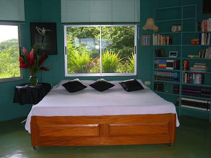 This is a very large room with overhead fan and light.  It includes a king-size bed w\large drawers underneath. There's also a very large desk w/comfortable office chair.  If desired we can provide two more double OR 2 queen-size floor mattresses.