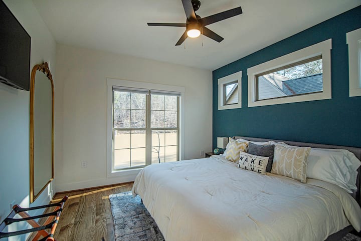Bedroom 2 has a king bed and a beautiful view of the pond.