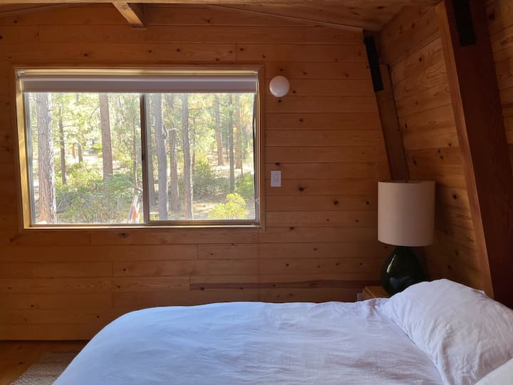 Bedroom One- 
Wake up to the treetops and forest views