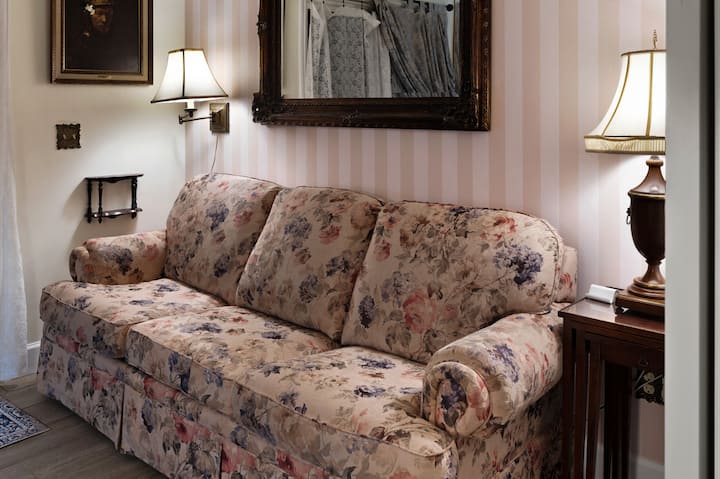 This room connects to the back patio, and the couch shown here unfolds into a very comfortable queen bed.