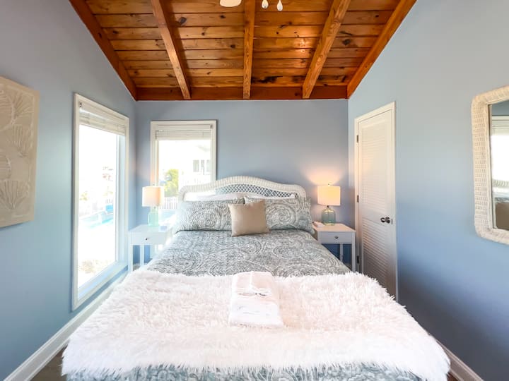 Bedroom 1: Upstairs bedroom has a Queen bed with two nightstands, each with reading lamps and power stations to keep all your devices charged.