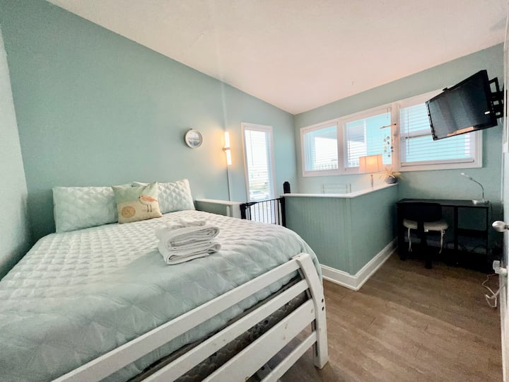Bedroom 3: Another upstairs bedroom includes a full bed, writing desk, wifi tv, and luggage rack.