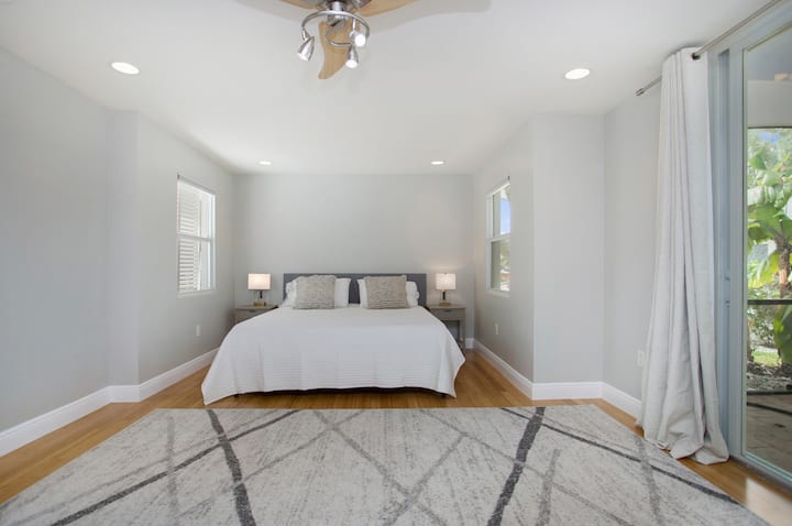 Spacious primary bedroom, steps away from the hot tub