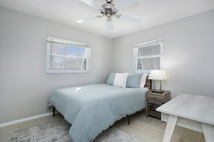 Queen-sized second bedroom with a workspace