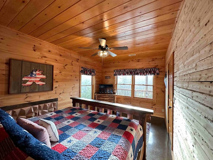 Basement bedroom hosts a comfy queen bed.