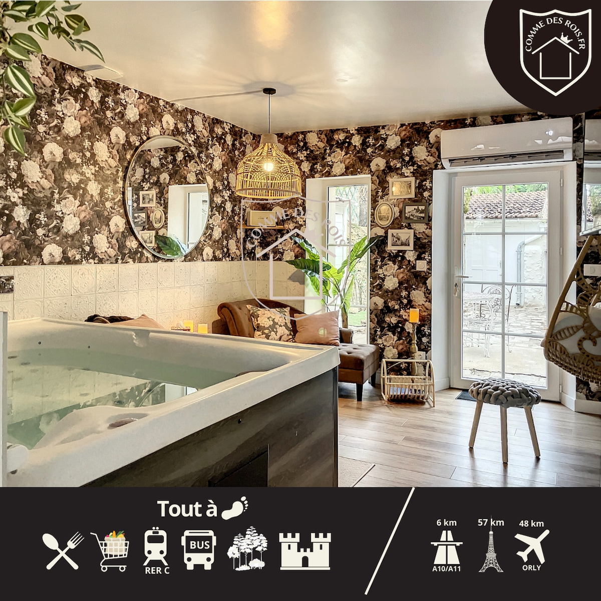A comfortable living space is highlighted by floral wallpaper and natural light. A cozy seating area includes a plush sofa and a side table. The jacuzzi is partially visible, inviting relaxation, and a decorative plant adds a touch of greenery. Outdoor access is available through the glass doors.