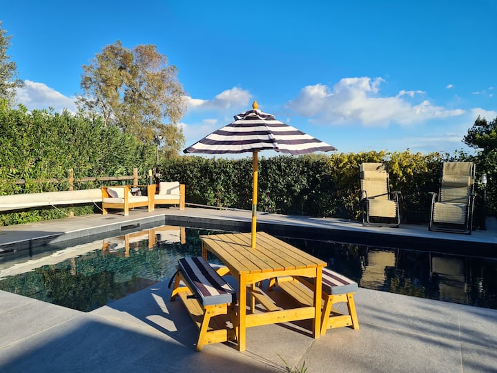 Portion of a villa with a private pool