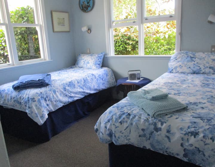 Two  new single beds with shared bathroom.