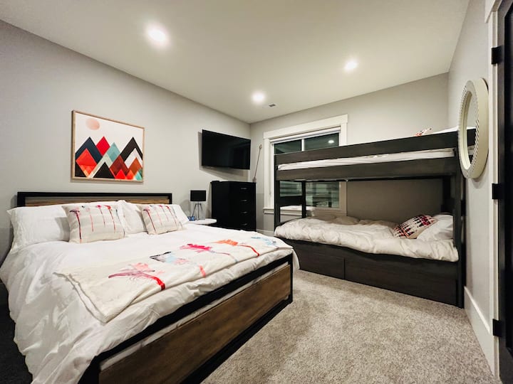 Queen and bunk bedroom with all of the comforts.  Wall-mounted TV above the dresser.  Plenty of closet space, and drawers under the bunk bed also.